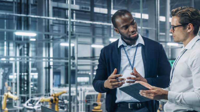 Two Diverse Automotive Industrial Engineers Talking